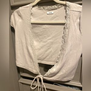 From garage. It’s a size small. It wraps around your and crosses in the front